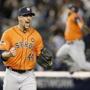 Houston Astros relief pitcher Luke Gregerson (44) reacts as a fellow teammate leaps in the air at the final out of the Astros 3-0 shutout of the New York Yankees in the American League wild card baseball game at Yankee Stadium in New York, Tuesday, Oct. 6, 2015. (AP Photo/Kathy Willens)