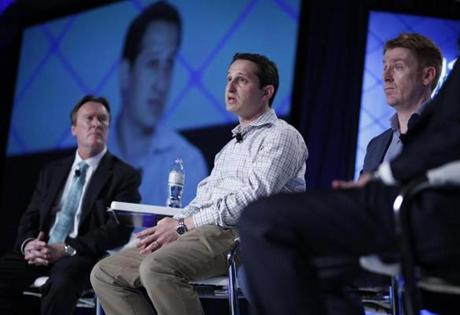In this Sept. 29, 2015, photo, Jason Robins, center, CEO of DraftKings website, speaks on a panel at the Global Gaming Expo in Las Vegas. His company?s rising visibility is spawning debate among the casino industry and regulators about the definition of gambling and whether all sports betting should be legalized and regulated. (AP Photo/John Locher)
