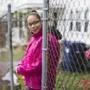 Jacqueline Carrasquillo, a former Long Island resident, stood in front of the halfway house where she lives in Dorchester.