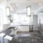 The kitchen counters are topped with Grigio Carnico marble from Italy.