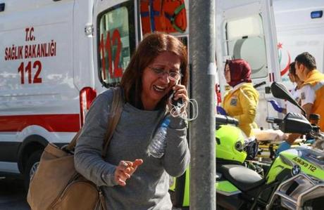 A woman spoke on her phone in Ankara, Turkey, after two explosions.
