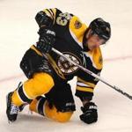 Bruins forward Brad Marchand was slow to get up after he was injured in the third period. Marchand left the game.