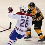 Boston-10/10/15-Boston Bruins vs Montreal Canadians- Bruins Brad Marchand knows he's guilty as he gets a slashing penalty in the 3rd period for whacking at Montreal's Nathan Beaulieu. Boston Globe staff photo by John Tlumacki(sports)