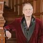 FILE - In this April 7, 2006 file photo, Playboy founder Hugh Hefner poses at the Playboy Mansion in the Holmby Hills area of Los Angeles. The new book 