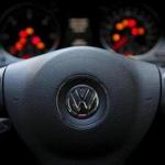 Volkswagen AG said that it would reduce investment spending at its main passenger-car brand by $1.1 billion per year.