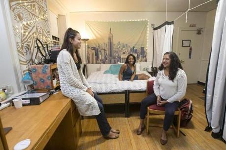 Harvard students (from left) Melody Gomez, Osaremen Okolo, and Andrea Delgado in their dorm room, the same one that Facebook founder Mark Zuckerberg lived in when he attended the university. 
