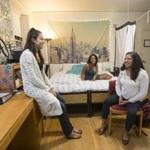 Harvard students (from left) Melody Gomez, Osaremen Okolo, and Andrea Delgado in their dorm room, the same one that Facebook founder Mark Zuckerberg lived in when he attended the university. 