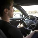 New Autopilot features are demonstrated in a Tesla Model S. 
