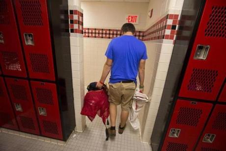 Rockport, Maine-Globe Staff Photo by Stan Grossfeld-October 7, 2015- Mason Mahonen,16, co captain of the football team at Camden Hills Regional High School finally cleans out his locker. The football season was cancelled on Sept. 24 due to safety concerns and low numbers. 
