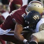 Wake Forest running back Matt Colburn, right, fumbles the ball against Boston College linebacker Matt Milano (28) late in the fourth quarter of an NCAA college football game in Boston, Saturday, Oct. 10, 2015. Wake Forest won 3-0. (AP Photo/Michael Dwyer)