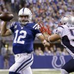 Colts quarterback Andrew Luck does his best to elude the onrushing Rob Ninkovich.