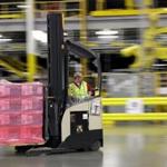 FILE - In this Feb. 13, 2015, file photo, a forklift operator moves a pallet of goods at an Amazon.com fulfillment center in DuPont, Wash. Amazon said Tuesday, Oct. 20, 2015, it will add 100,000 holiday jobs this season across the country in its fulfillment and sortation centers, so that it can meet increased customer demand. (AP Photo/Ted S. Warren, File)
