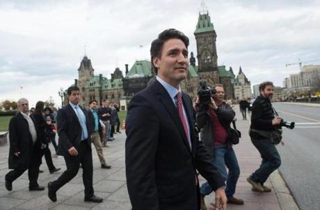 Justin Trudeau walked from the parliament building to a press conference in Ottawa on Monday, a day after his Liberal Party won a legislative majority.
