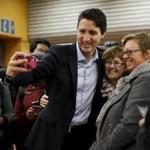 Liberal leader and prime minister-designate Justin Trudeau took a selfie while greeting people in Montreal Tuesday.