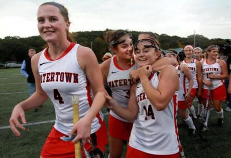 Watertown, MA: 10-21-15: Watertown's field hockey team, including (l-r, foreground) captain Ally McCall, captain Michaela Antonellis, and Kourtney Kennedy celebrate their win over Melrose at Victory Field in Watertown, Mass. October 21, 2015. The game was Watertown's 154th without a loss, a national record. Photo/John Blanding, Boston Globe staff story/, Sports ( 22watertown) )
