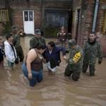 Soldiers helped evacuate a flooded house Saturday in Zoatlan, Nayarit. Although flooding appeared to be minor, more than 1,000 Mexicans were forced to take refuge in shelters. Some areas experienced more than 10 inches of rain.