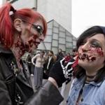 Nicole Ricketson of Revere put make up on Alexandrea Kiklis of Jamaica Plain before the start of the zombie march in Boston on Saturday.