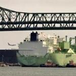 Energy companies are seeing weaker demand for natural gas in Asia and Europe. Above: An LNG tanker passed under the Tobin Bridge and into the Mystic River in Chelsea.