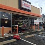 A woman crashed her car into a Dunkin? Donuts shop Sunday.