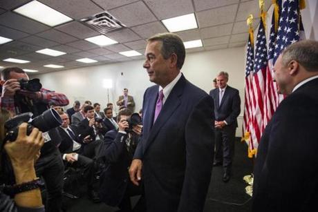 epa04998672 Republican Speaker of the House from Ohio, John Boehner (C) leaves a press conference after announcing that he has a bipartisan budget agreement between Congress and the White House in the US Capitol in Washington, DC, USA, 27 October 2015. Boehner has worked hard to push the two-year budget deal before he leaves Congress on 30 October. EPA/JIM LO SCALZO
