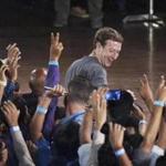 Facebook?s CEO Mark Zuckerberg interacts with technology students in a town hall-style meeting in New Delhi, India, Wednesday, Oct. 28, 2015. Zuckerberg is his second visit to India this year alone. (Shirish Shete/Press Trust of India via AP)