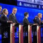 John Kasich, left, and Donald Trump, second from right, argued across fellow candidates during the Republican debate.