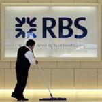 A worker swept in the foyer of a Royal Bank of Scotland (RBS) office in London, Britain, in this August 6, 2010 file photo.