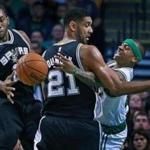 11/01/15: Boston, MA: The Celtics Isaiah Thomas (right) loses control of ther ball as he tries to make a first quarter pass behind the back of the Spurs Tim Duncan (21). San Antonio's Kawhi leonard (2) is ready to grab it at left. The Boston Celtics hosted the San Antonio Spurs in a regular season NBA basketball game at the TD Garden. (Globe Staff Photo/Jim Davis) section:sports topic:Celtics-Spurs (1)
