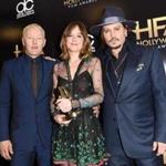 Joel Edgerton, Dakota Johnson, and Johnny Depp pose with Edgerton?s Hollywood Breakout Actor Award for ?Black Mass.? 
