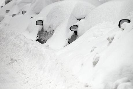 Snow-covered cars were seen in South Boston last February.
