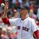 Boston Red Sox starting pitcher Clay Buchholz gets the ball back against the Toronto Blue Jays during the first inning of a baseball game at Fenway Park in Boston Saturday, June 13, 2015. (AP Photo/Winslow Townson)