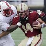 Boston College quarterback John Fadule (14) is taken down by North Carolina State safety Dexter Wright (34) during the first half of an NCAA college football game in Boston, Saturday, Nov. 7, 2015. (AP Photo/Charles Krupa)