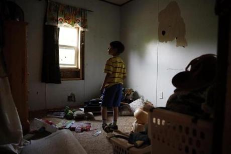 Oxford, Maine -- 5/28/2015-- Strider walks through his room on the night of the deadline his family has been given to remove their things in Oxford, Maine May 29, 2015. Jessica Rinaldi/Globe Staff Topic: 31strider Reporter: 
