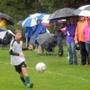Parents and fans lined the field with umbrellas as they watched youth soccer on a rainy day at Gordon Field in Silverdale, Wash., last month.