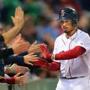 Boston- 09/26/15 - Red Sox vs Orioles- Sox Mookie Betts slaps hands with fans near the Sox dugout as he scored on an 8th inning two-run rbi by Sox Xander Bogaerts. Boston Globe staff photo by John Tlumacki(sports)