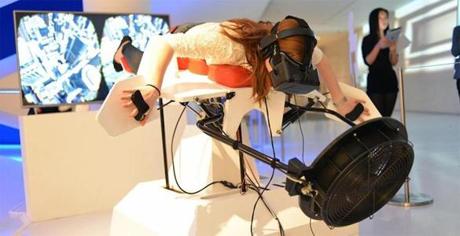 12birdly -- A user tries out Birdly, a 3-D exhibit that lets people experience what it's like to be a bird soaring through New York City. (swissnex Boston)
