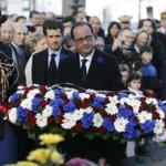 French President Francois Hollande laid a wreath in front of a statue in Paris on Wednesday.