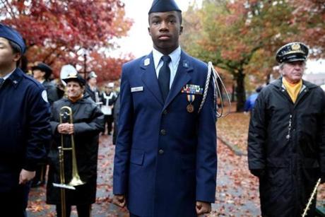 Cristian Hall waited to march with the Charlestown High School Air Force Junior ROTC in the Veterans Day parade in Boston.
