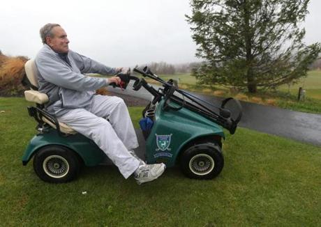 Bob Lobel at the Granite Links Golf Course in Quincy, where they allow him to play with his cart.
