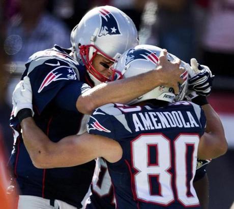 Foxborough, MA-September 28, 2015-Globe Staff Photo by Stan Grossfeld- Tom Brady embraces Danny Amendola after throwing a TD pass vs. Jaguars at Gillette Stadium.
