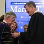 Massachusetts Governor Charlie Baker hung the symbol of office around the neck of University of Massachusetts President Marty Meehan. 
