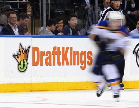 The New York Rangers and St. Louis Blues skated in front of board advertising  forthe betting website DraftKings at Madison Square Garden on Thursday.

