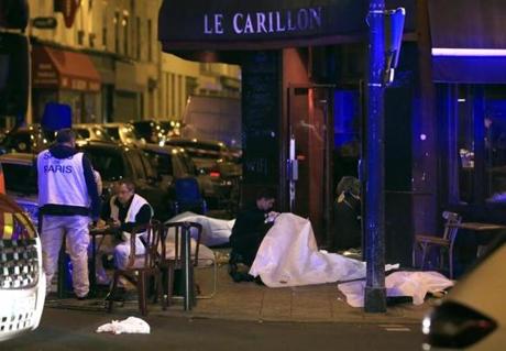 Victims were seen on the pavement near a Paris restaurant.
