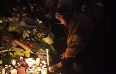 Mourners placed candles near the Rue de Charonne, one of the sites targeted in a string of attacks in Paris.
