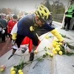 Cyclist Matthew J. Donovan placed flowers on the steps of the State House. 