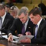 Flanked by First Assistant Attorney General Chris Barry-Smith (left) and Boston Mayor Martin J. Walsh, Governor Charlie Baker prepared to testify at the State House Monday. 