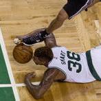 Boston, Ma- November 1, 2015- Globe Staff Photo by Stan Grossfeld-Marcus Smart of the Celtics steals the ball from San Antonio's Tony Parker and then passes to a cutting teammate for a bucket at the TD Garden