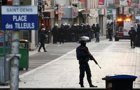 French riot police secured a street in Saint-Denis, a suburb of Paris, Wednesday morning.
