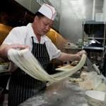 Chef Hou making hand-pulled thin noodles at Live Noodles. 