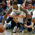 11/18/15: Boston, MA: Dallas' Jose Berea (right,a product of Northeastern University in Boston) dives at a loose ball as the Celtics Marcus Smart (left) moves to pick it up and start a break the other way in the first half. Smart had the break, but Avery Bradley (0), was whistled for a foul on the play, which sent the crowd, the Celtics and head coahc Brad Stevens into an uproar. The Boston Celtics hosted the Dallas Mavericks in a regular season NBA basketball game at the TD Garden. (Globe Staff Photo/Jim Davis) section:sports topic:Celtics-Mavericks (1)